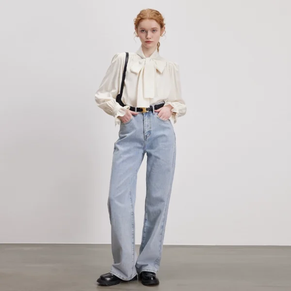 A woman in a bow shirt