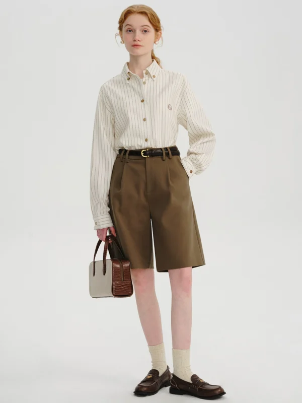 A woman in a striped linen shirt