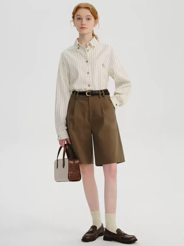 A woman in a striped linen shirt