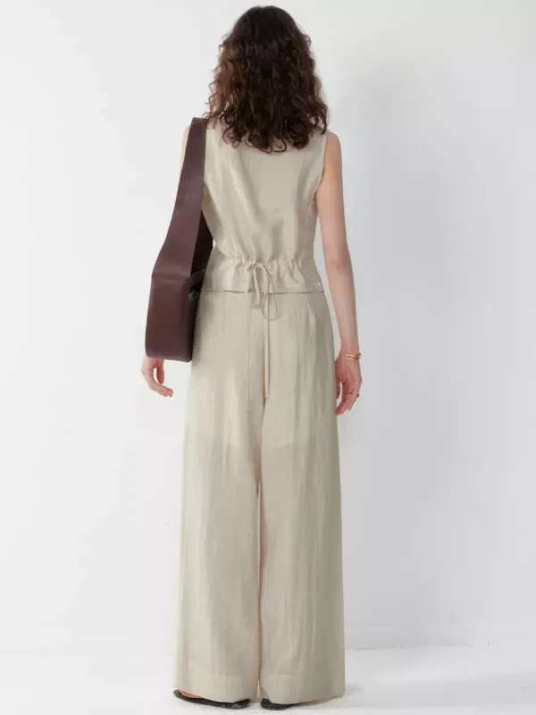 A two-piece set of pleated waistcoat and trousers for women