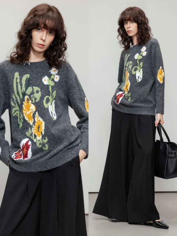 A woman in a color-blocking floral jacquard sweater