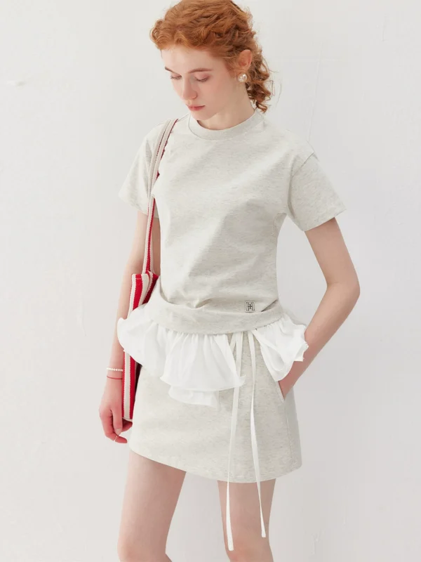 A two-piece set of round-neck T-shirt and sports short skirt