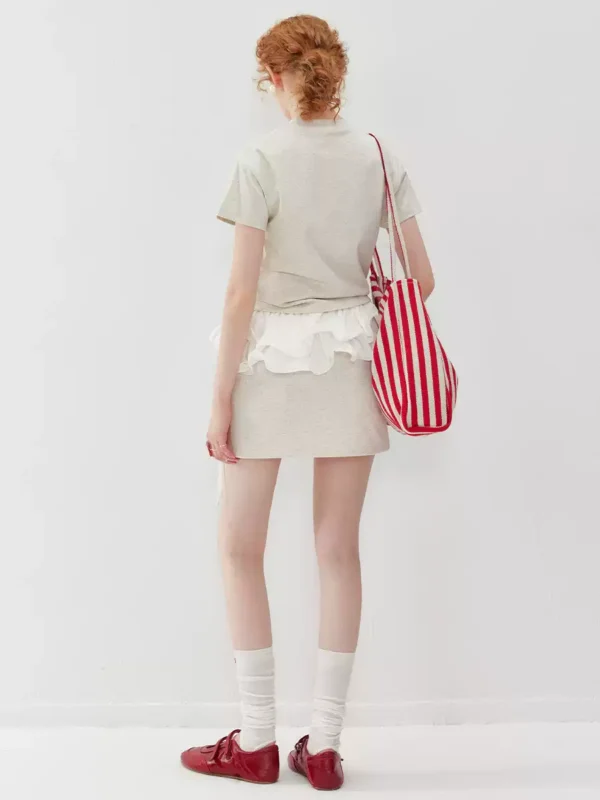 A two-piece set of round-neck T-shirt and sports short skirt