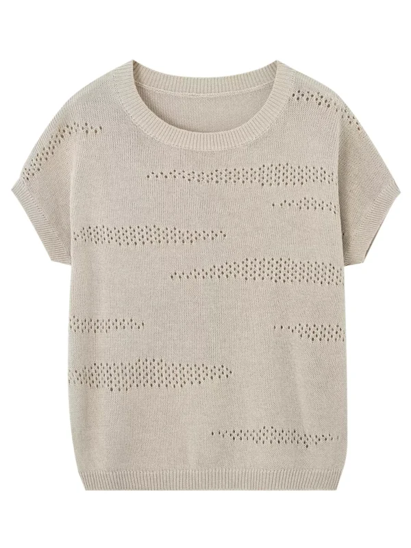A woman wearing a retro perforated sweater