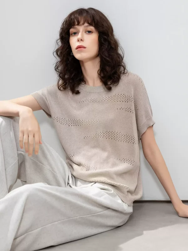 A woman wearing a retro perforated sweater
