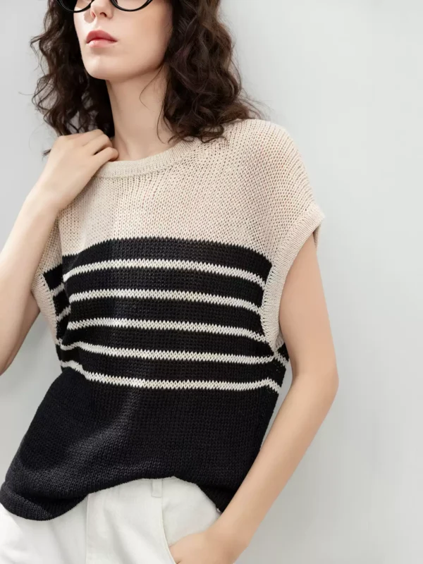 A striped knitted sweater with a hollowed-out design