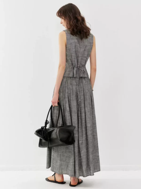 A linen vest suit with a large skirt hem