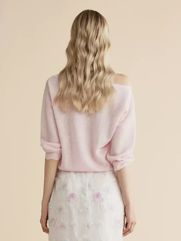 A light pink off-the-shoulder beaded knitted sweater