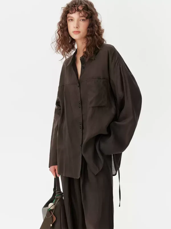 A light shirt and loose trousers suit