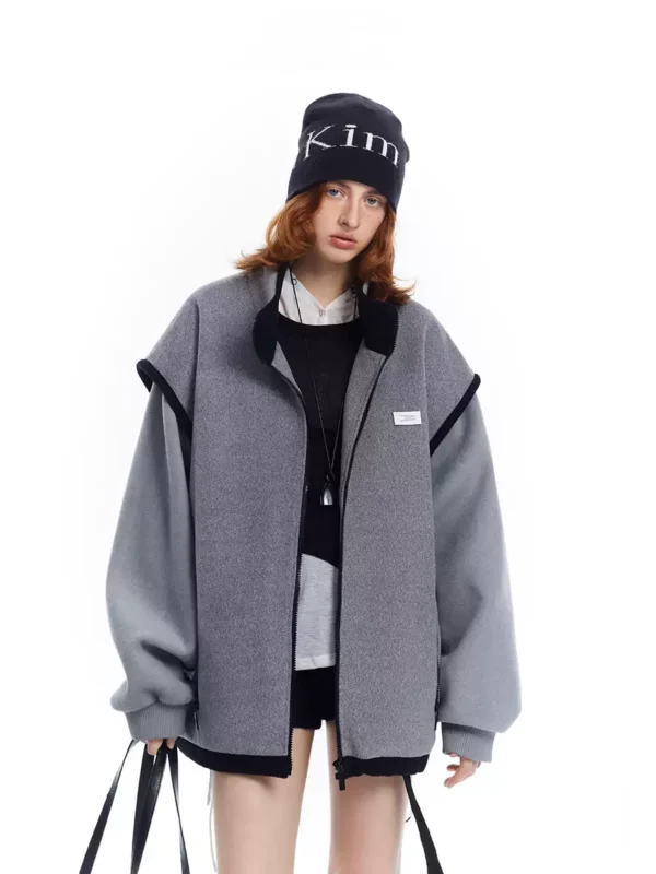 A woman in a grey patchwork woolen coat