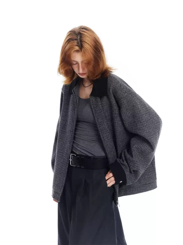 A woman wearing a checkered lapel coat