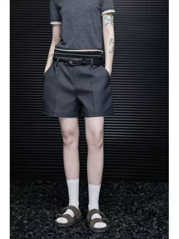A woman in loose grey high-end shorts - Image 2