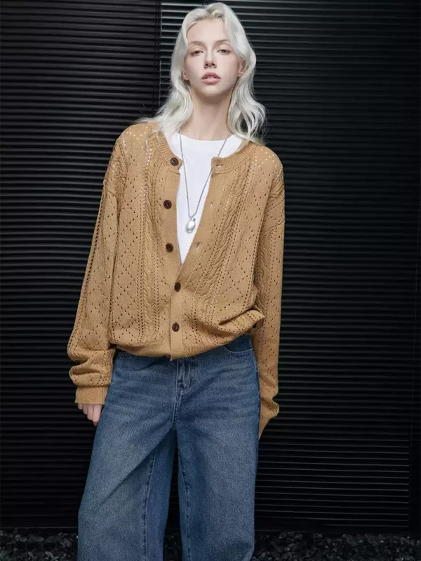 A women's knitted cardigan with a hollowed-out design