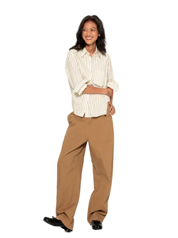 Women in asymmetrical long-sleeved shirts