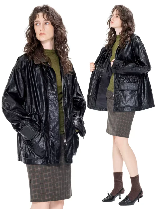 A woman in a windbreaker with a leather collar - Image 2