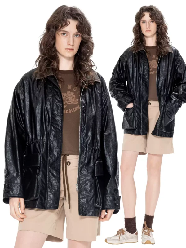 A woman in a windbreaker with a leather collar