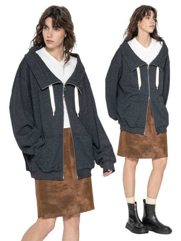 A woman with a loose coat that has been smudged - Image 2