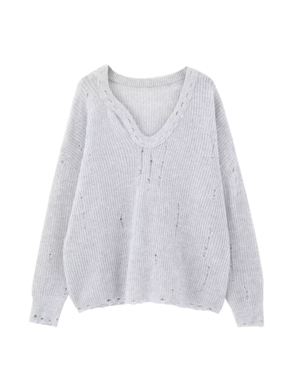 A woman in a laid-back grey heart-neck sweater - Image 4