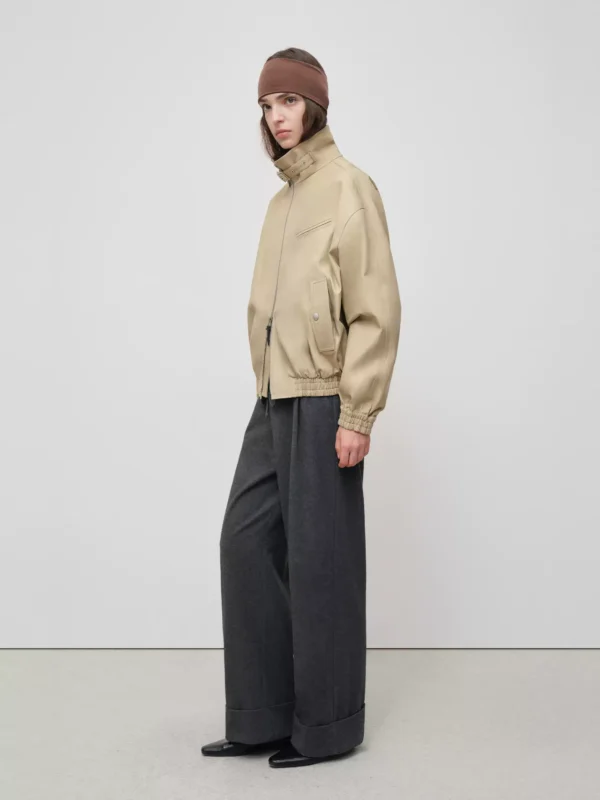 A woman wearing a jacket - Image 4