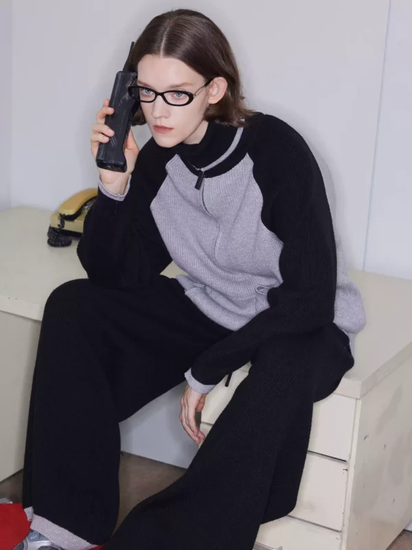 A woman in laid-back black knitted wide-leg pants - Image 3