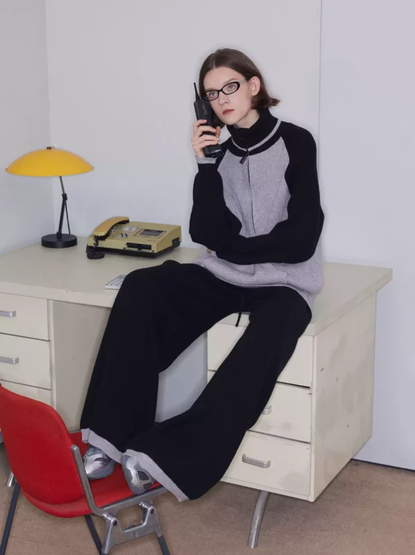 A woman in laid-back black knitted wide-leg pants - Image 2