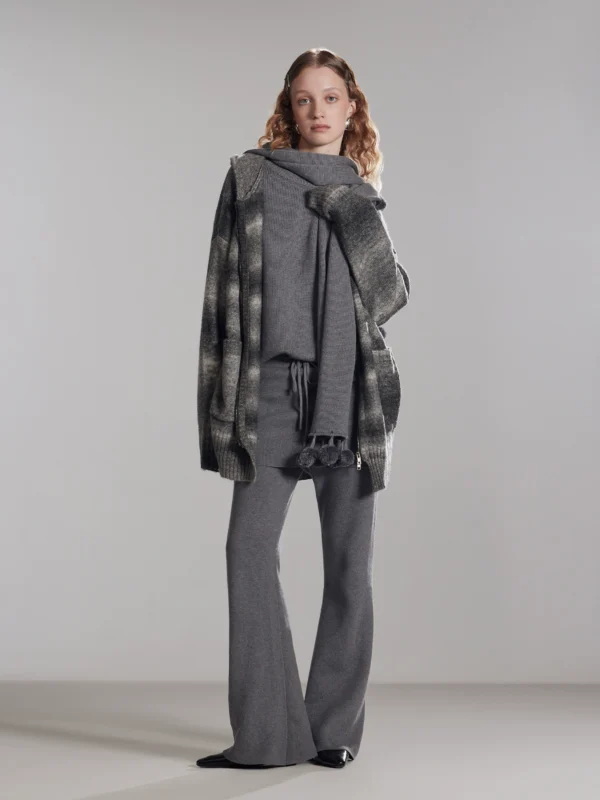 A woman wearing two fake cashmere knitted culottes