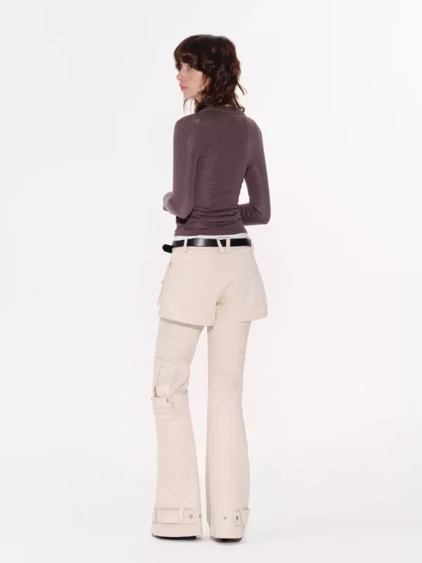 A woman wearing two pairs of reverse cargo pants - Image 2