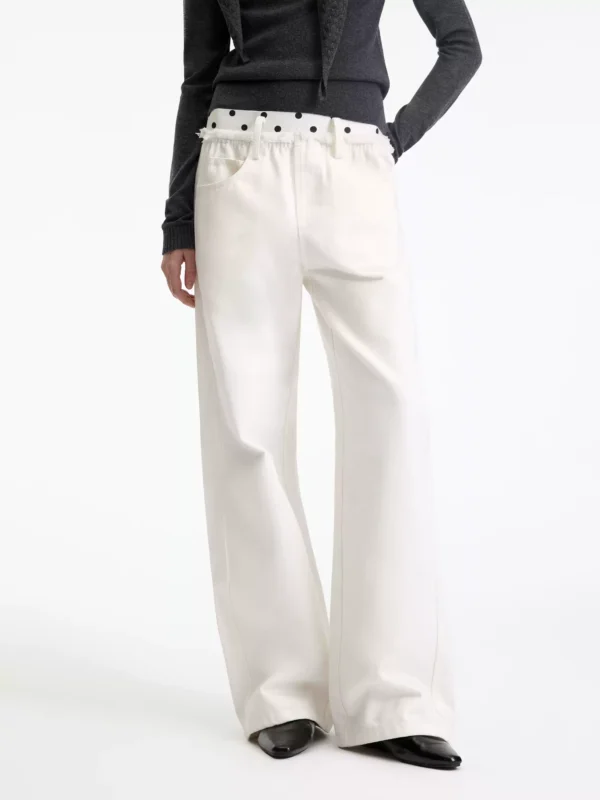 A woman in beige polka dot casual pants - Image 3