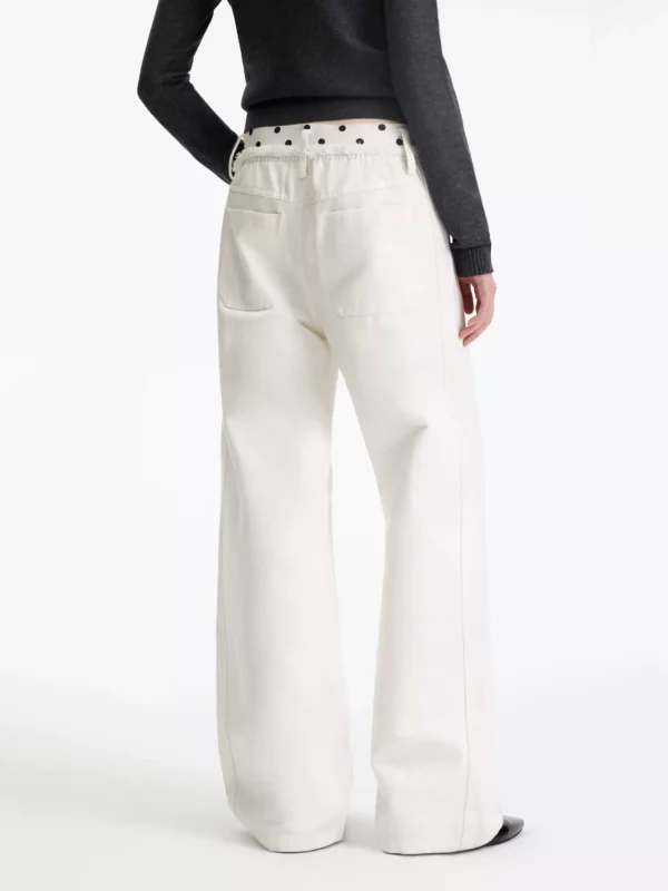A woman in beige polka dot casual pants - Image 4