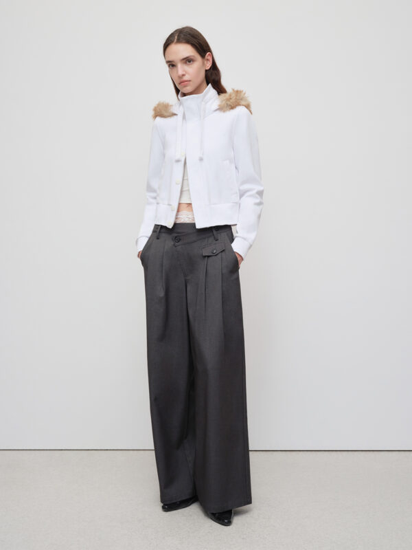 Women in irregular-waisted design trousers