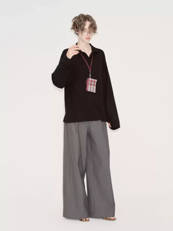 A woman in a grey suit pants with a sense of design - Image 3