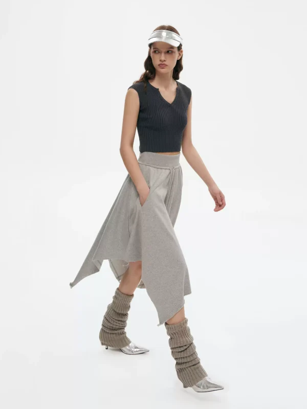 a woman in an irregularly fringed A-line skirt - Image 2