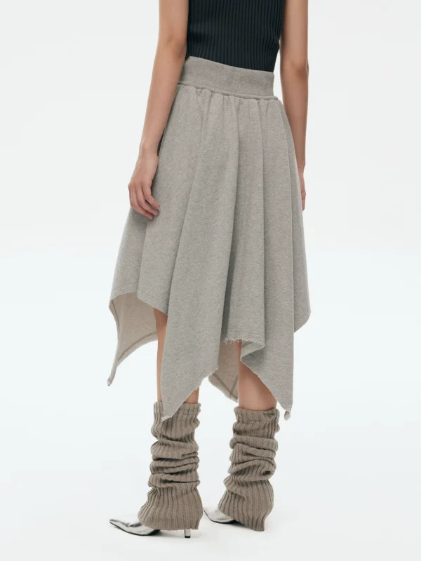 a woman in an irregularly fringed A-line skirt - Image 3
