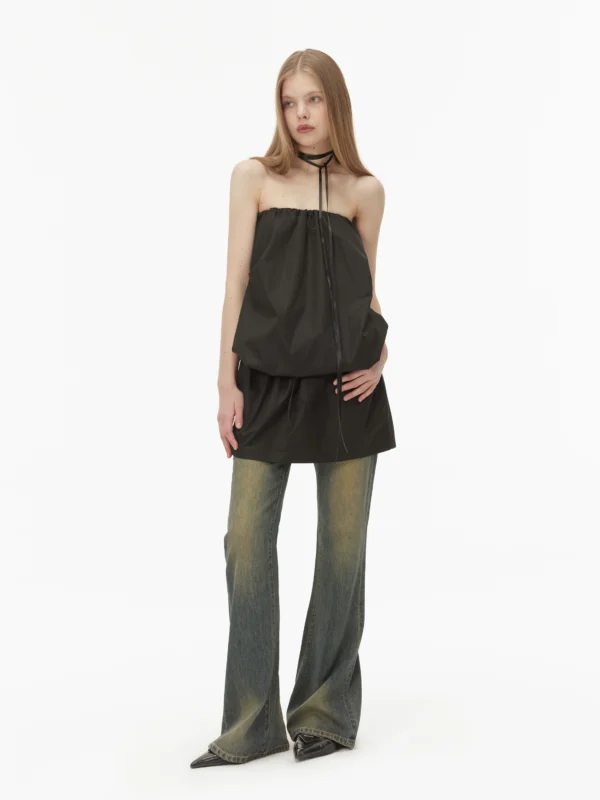 Wear two black strapless dresses with one shoulder