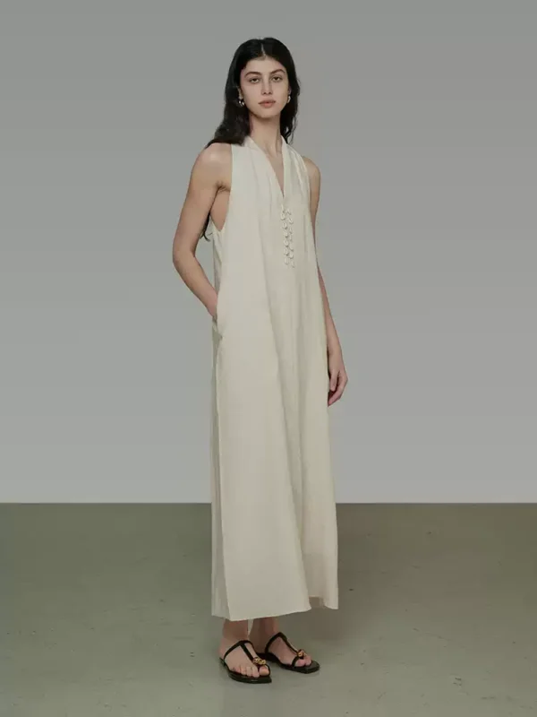 A woman in a V-neck halter dress - Image 2