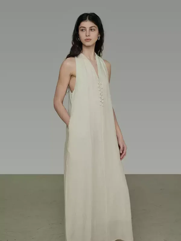 A woman in a V-neck halter dress - Image 3