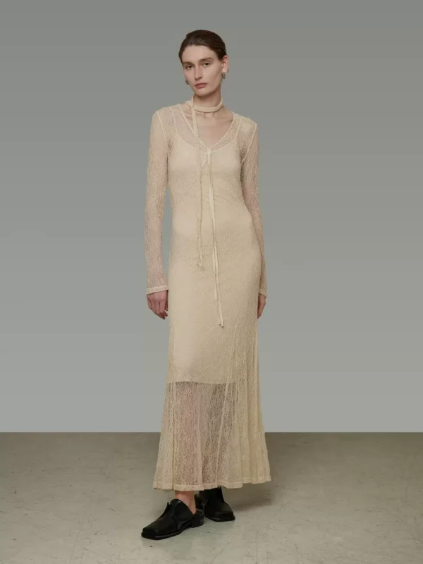 A woman in a slightly transparent V-neck dress - Image 2